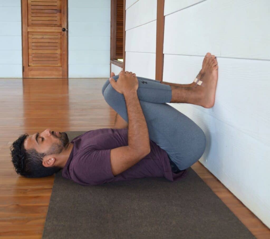 The Elevated Legs-Up-the-Wall Pose (Viparita Karani Mudra) focuses on  stretching the front of your body along with your… | Yoga bolster, Legs up  the wall, Wall yoga
