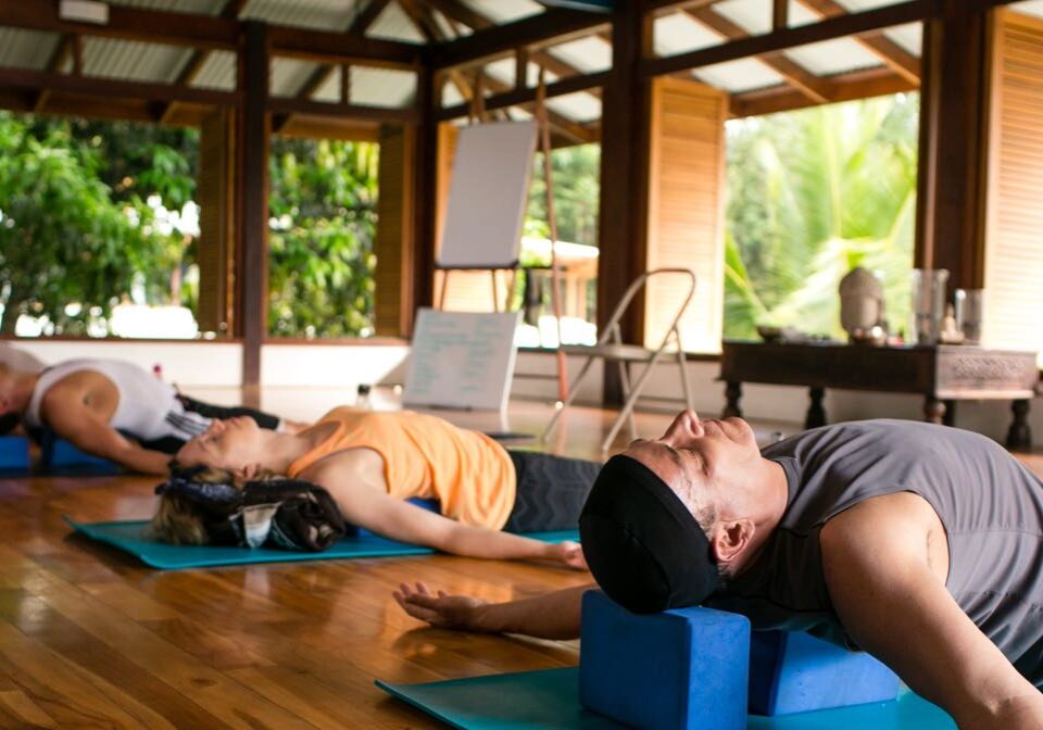 Group in Savasana Yoga Pose at Resort | Blue Osa